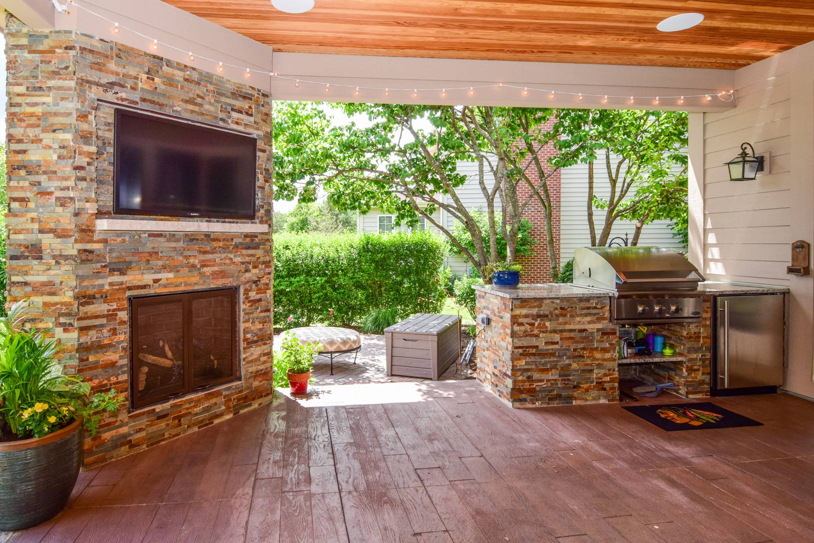 remodeled covered patio with fireplace and built-in grill