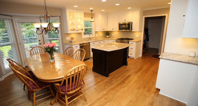 remodeled kitchen with dark wood island
