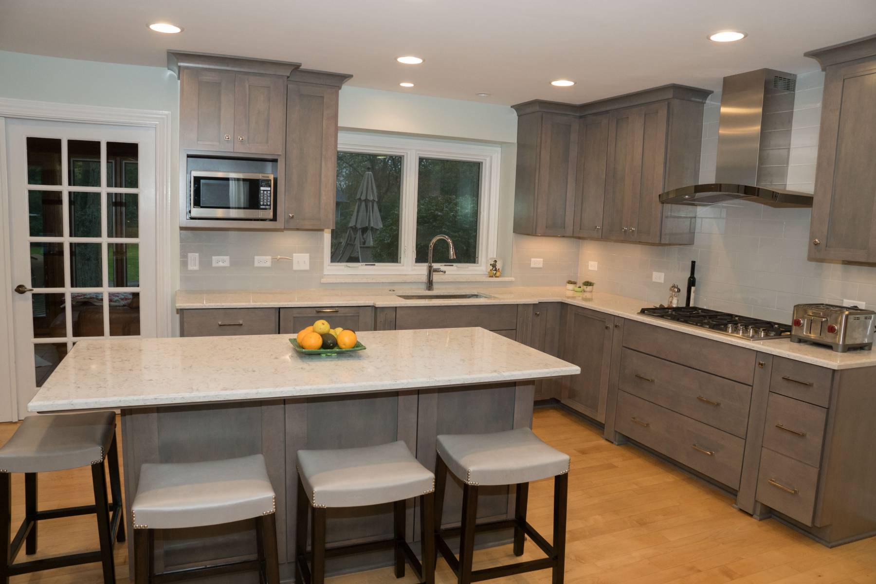 Modern grey kitchen range with stainless steel hood