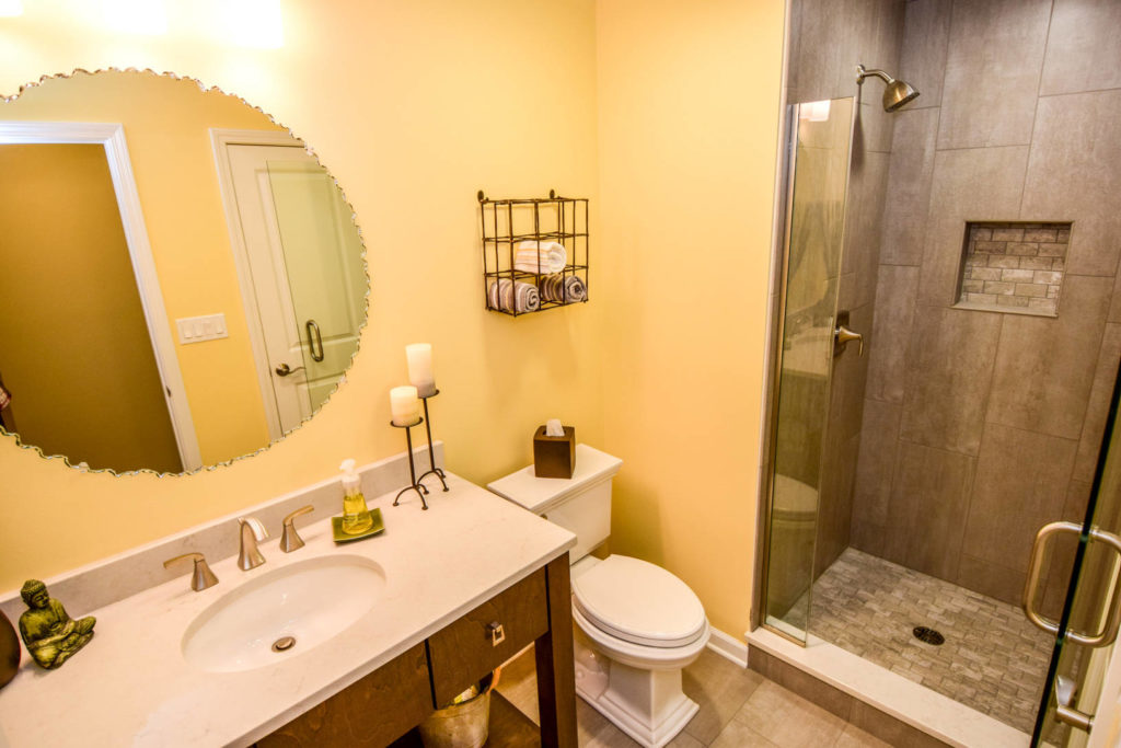 yellow bathroom with slate gray standing shower