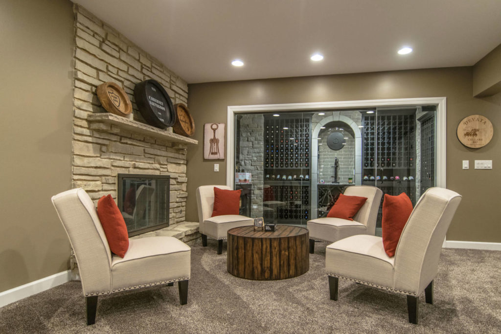 sitting room in front of wine cellar in finished basement