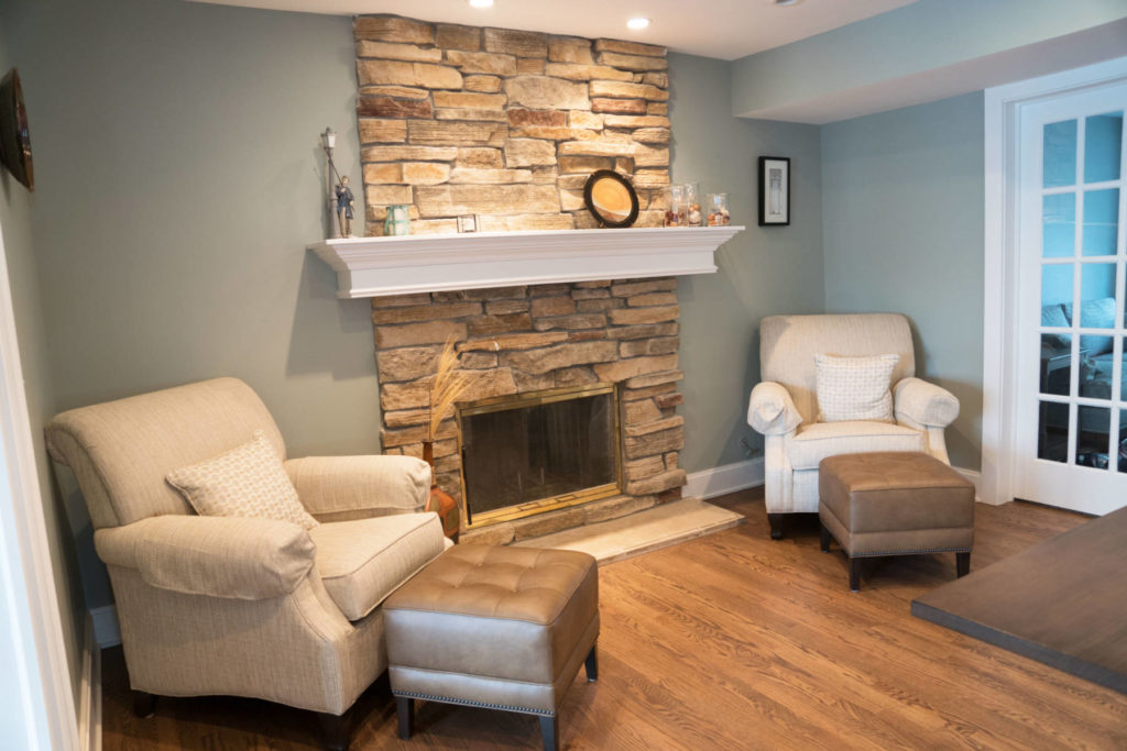 sitting area with stone fireplace