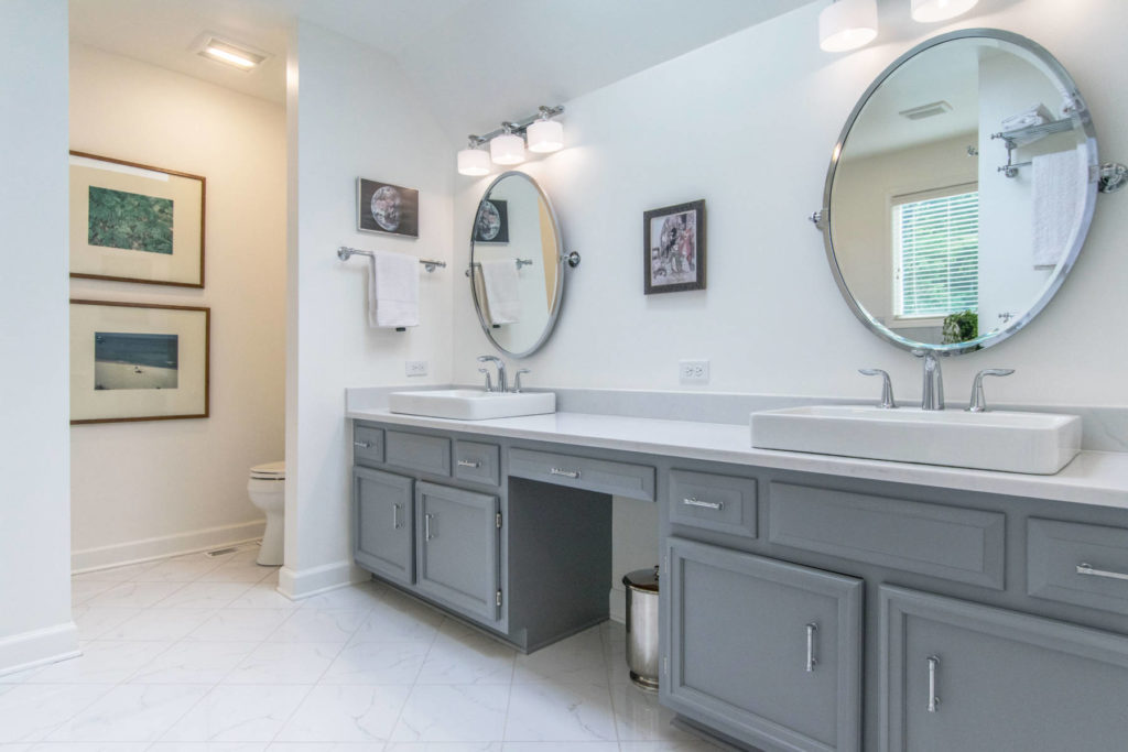 Gray and white bathroom with double vanity