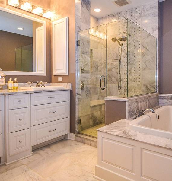 Remodeled white bathroom with stand-up shower