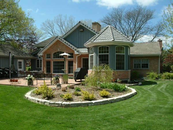 Traditional home with large patio and landscaping